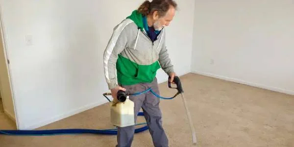 Coupon Specials In Indianapolis Carpet Cleaning Services 4 A Man Holding A Canister And A Hose